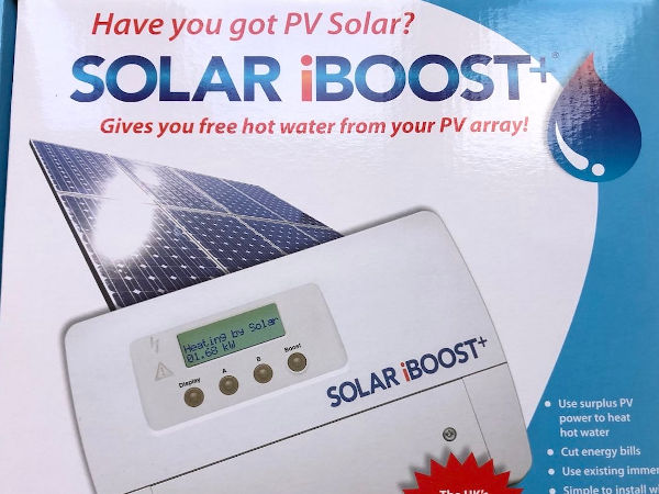 Image of a white plastic box with an electronic screen and a picture of solar panels in the background