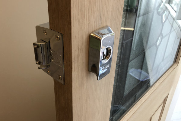 Shiny stainless steel ERA lock fitted onto door