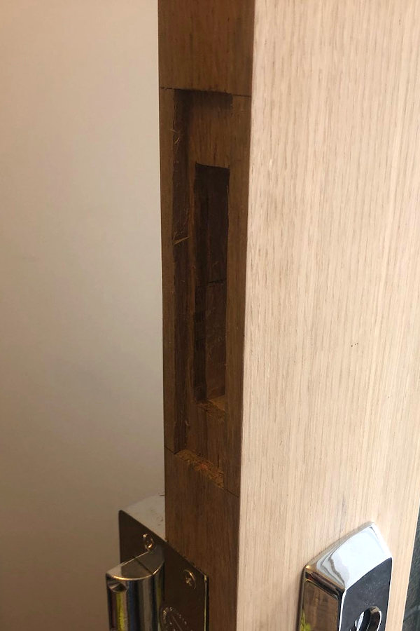 Rectanglar cut-out in the side of the door to take a deadbolt